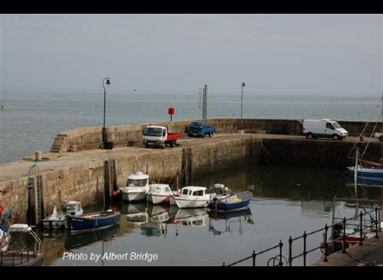 Annalong inner harbour with the red pierhead mark showing over the top
