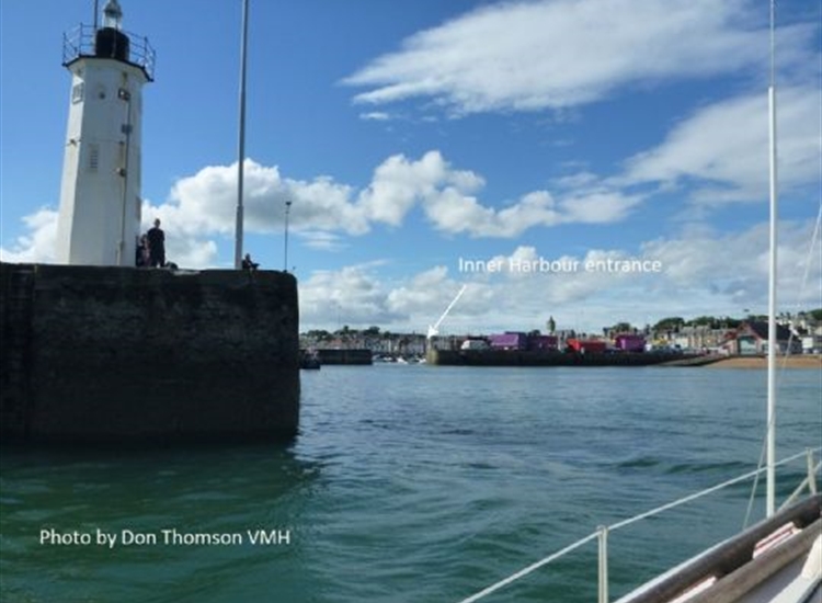 Passing through Harbour entrance with inner harbour off to Port