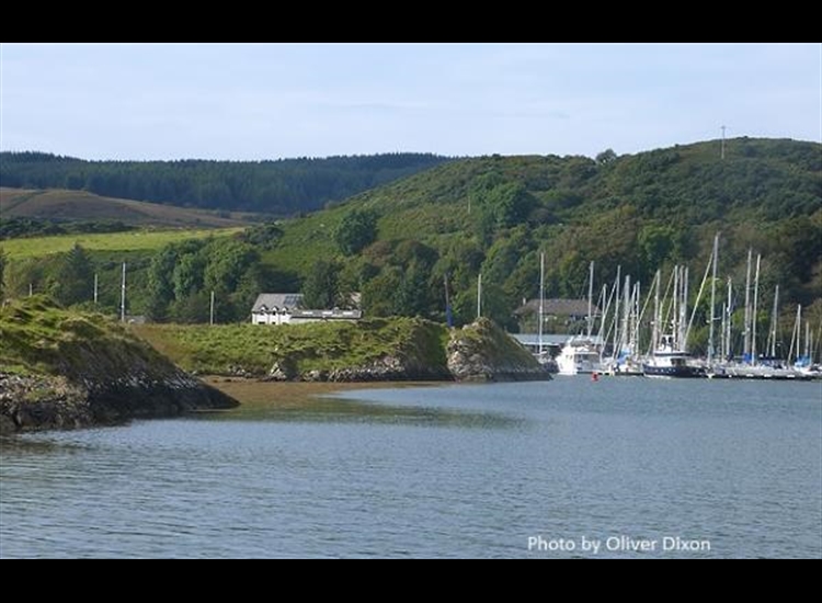 Ardfern from South. Entrance just opening around the island