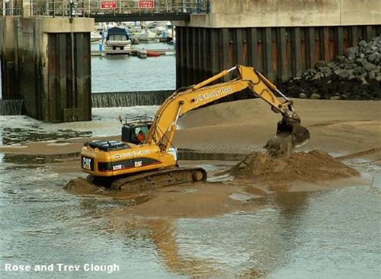 Periodic dredging of entrance