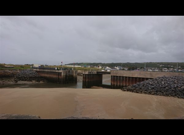 Tidal gate from outside. Note the sandbank in the foreground
