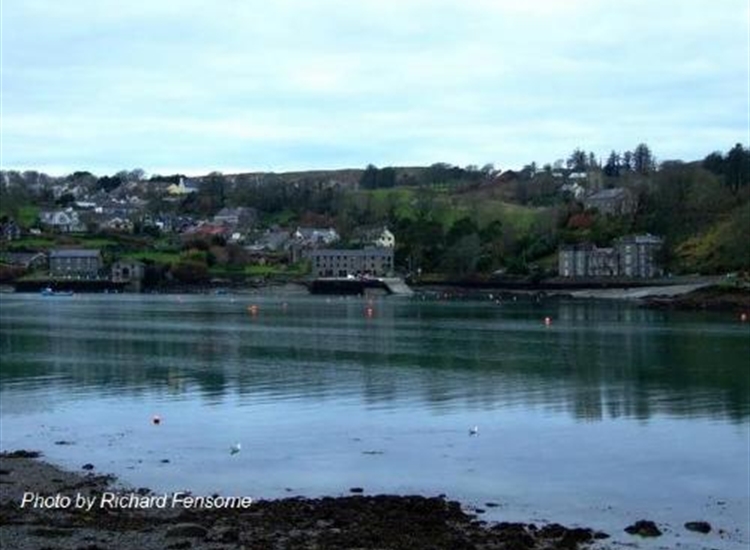 Castletownshend water front. Slip, centre. Castle with Church above centre right