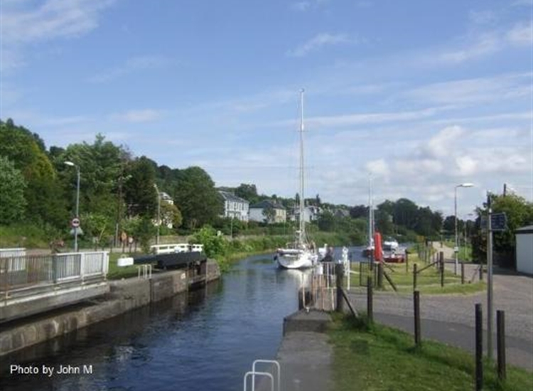 5. Crinan Canal. Yacht departing Ardrishaig flight Westwards at Lock 4 with two waiting to lock in.
