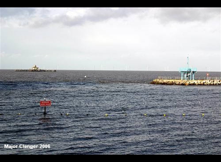 Breakwater, note detached defunct end of pier and WINDFARM in distance, a few miles off the coast