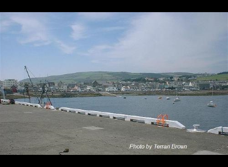 Port St Mary. Outer Harbour looking West from the wall