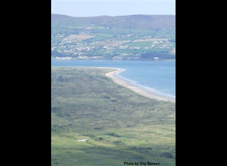 Hazy photo of Magilligan Straits from the East.