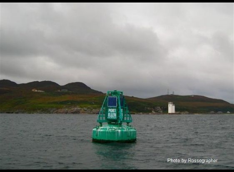 Buoy off Port Ellen with Carraig Fhada LH and the radio masts atop the hill in distance