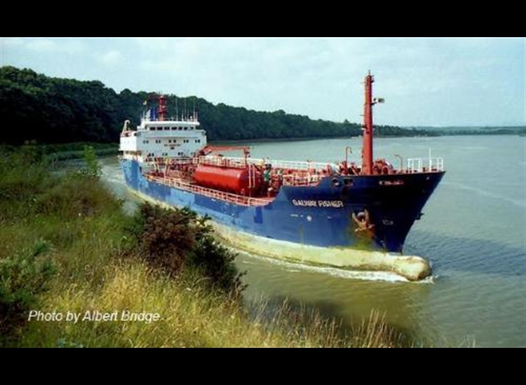 Tanker outbound at Pink Point. Channel very close to the shore