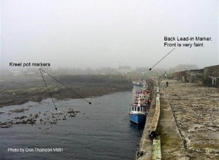 Rosehearty Looking inwards towards the inner harbour entrance at Half tide. The lead in marks can just be seen.