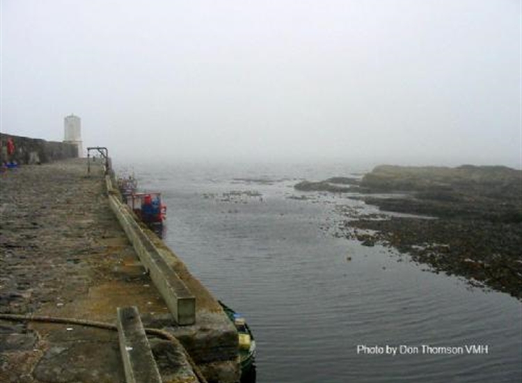 Rosehearty looking Northwards along the pier at half tide. Very narrow.