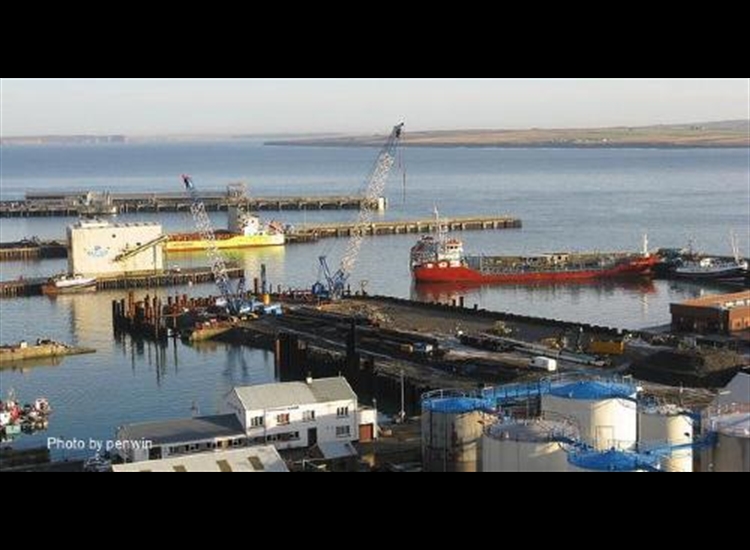 Scrabster looking over harbour towards Dunnet Bay and Dunnet Hill in distance