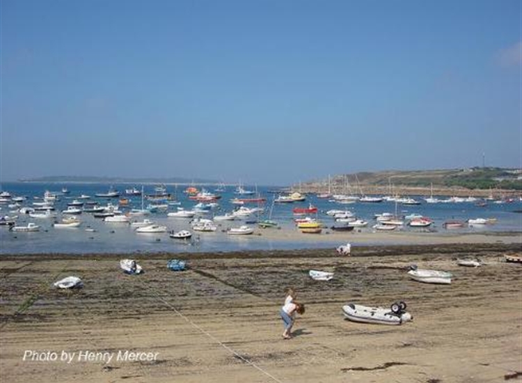 St Mary's Pool from the beach. Local moorings foreground. Vistors centre right