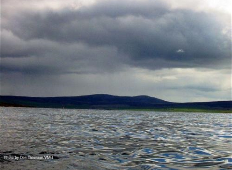 Looking past a rain storm at Hoy