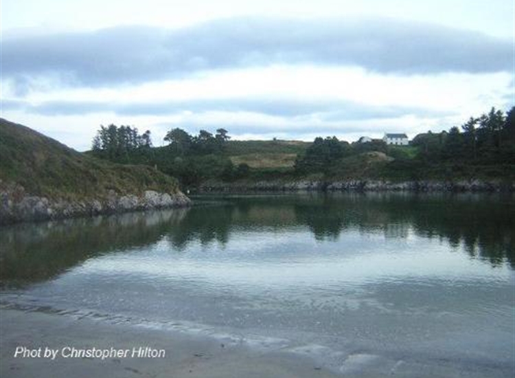 Tragumna Bay. Tralispeen Beach. Little dog-legged drying cove on West side of bay