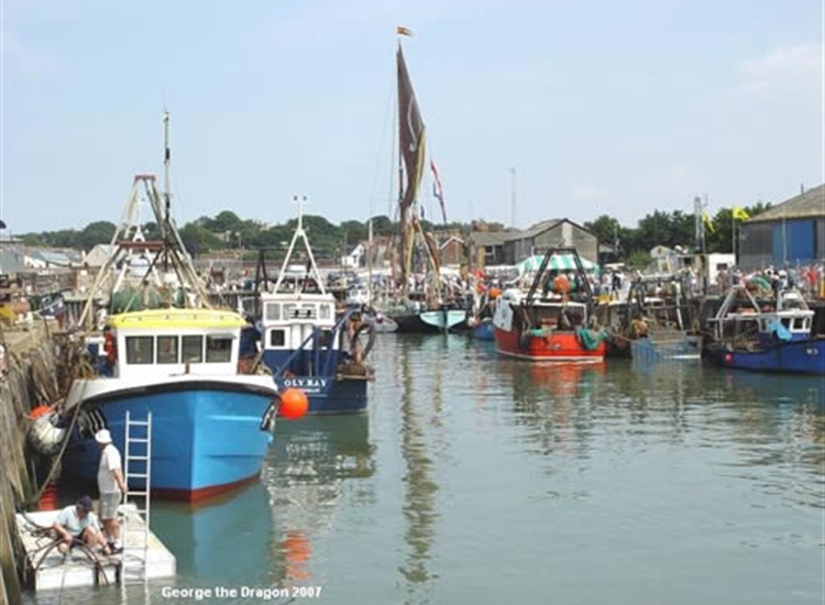 3.Interior of Harbour, full of fishing boats and a barge...note no yachts.